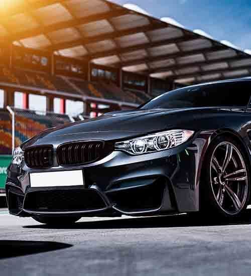Customers loading luggage into a self-drive rental car